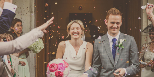 bride and groom showered with confetti, Hackney Town Hall wedding, Photographer wedding eastLondon, Documentary wedding photographer London, Photojournalist wedding photographer London, South East London wedding photographer
