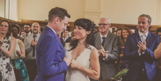 Reportage wedding photographer south london, dulwich college wedding, bride and groom fist bumping London wedding, london wedding photographer
