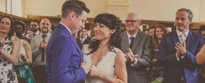 Reportage wedding photographer south london, dulwich college wedding, bride and groom fist bumping London wedding, london wedding photographer